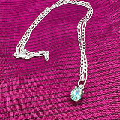 Azotic topaz oval on sterling silver setting and chain. Chain is 40 cm long