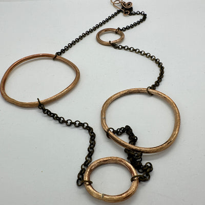 Bronze shapes on chain