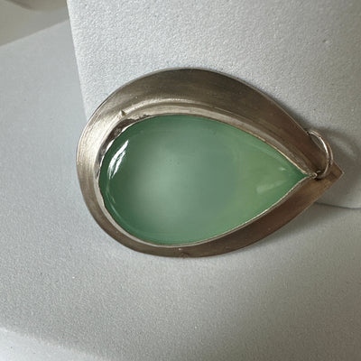 Silver pendant with pear shaped green cabochon