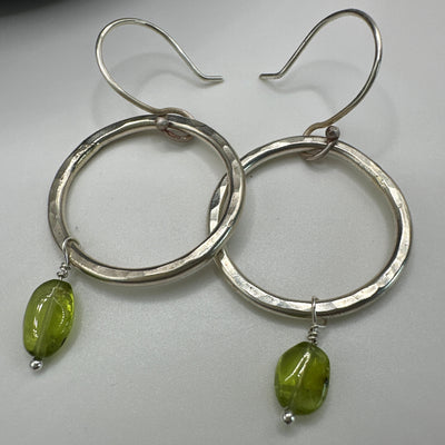 Silver round rings and oval peridot earrings