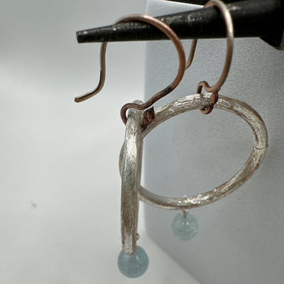 Silver round rings and aquamarine earrings