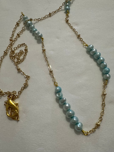 Necklace featuring freshwater pearls -light turquoise- on brass chain