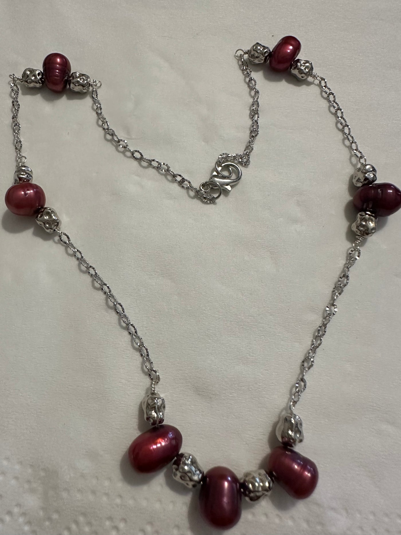 Necklace with red freshwater pearls on rhodium plated brass chain