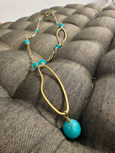 Necklace with bronze oval elements and turquoise jade pearls on  brass chain