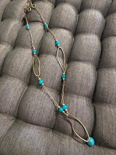 Necklace with bronze oval elements and turquoise jade pearls on  brass chain