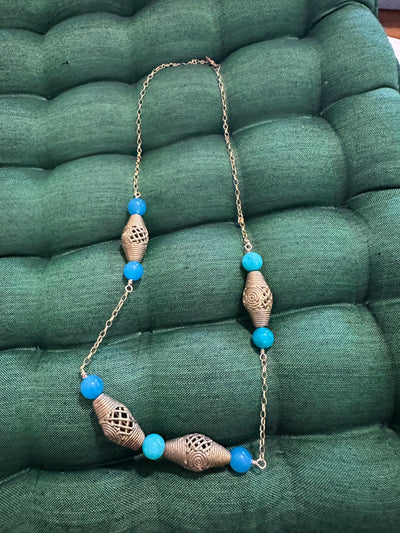 Necklace with brass elements and turquoise jade pearls on brass chain