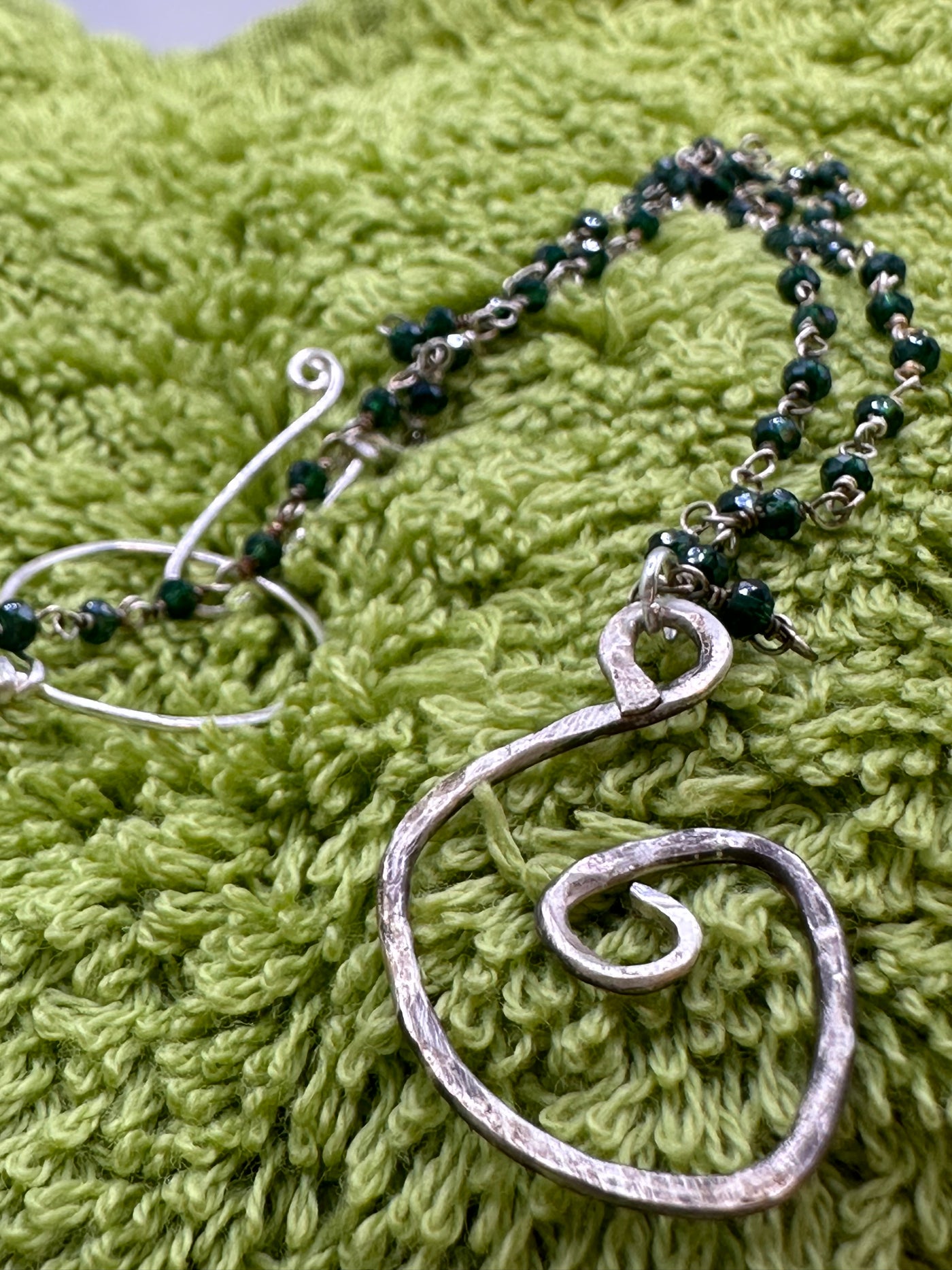 Silver and green beads with silver abstract pendant