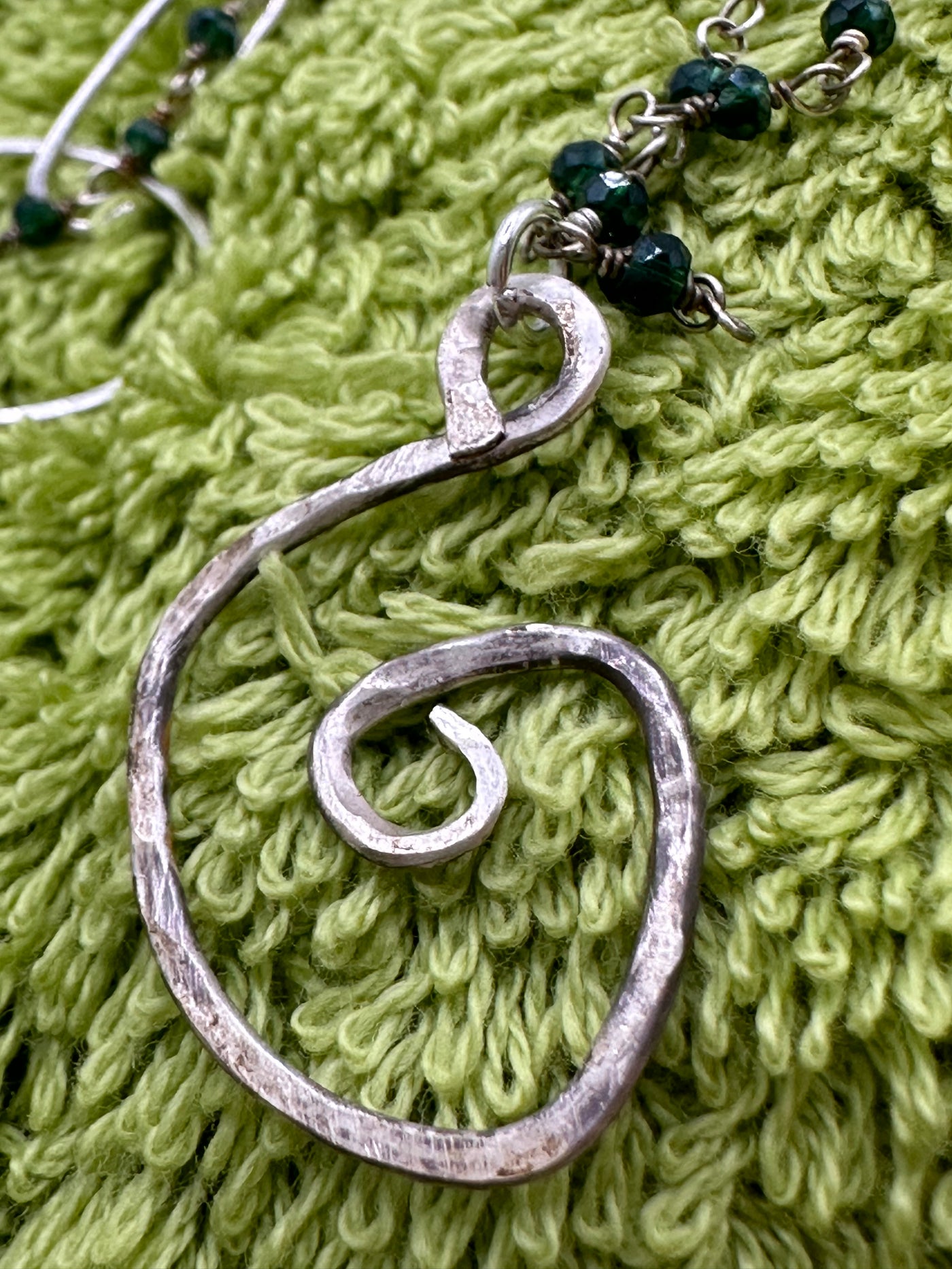 Silver and green beads with silver abstract pendant
