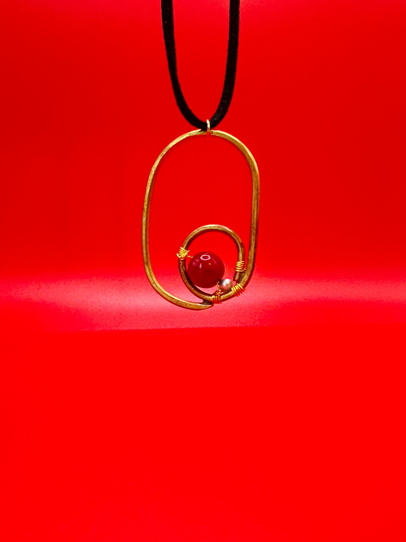 Brass, red bamboo coral and Freshwater pearls pendant on black leather