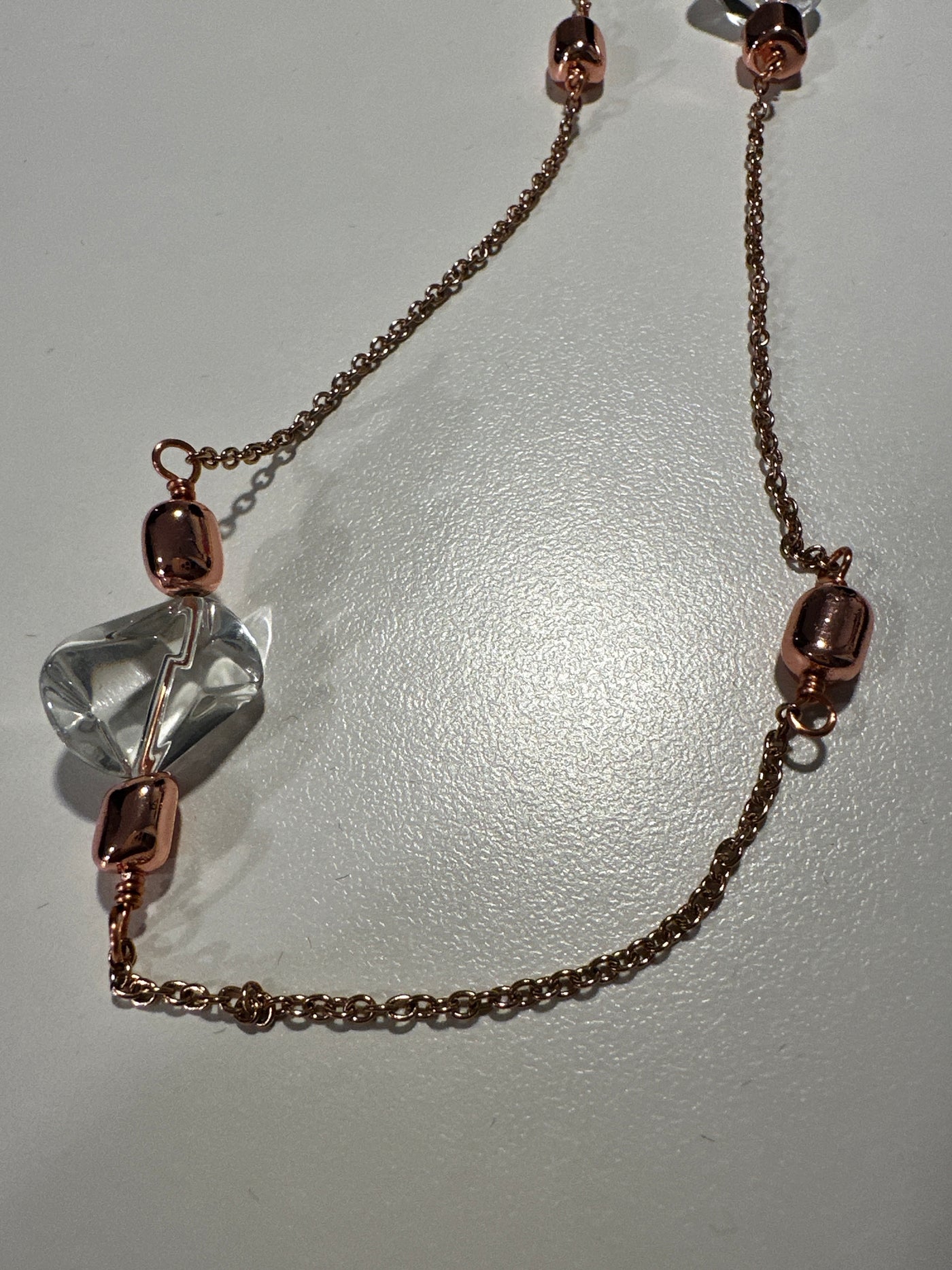 Transparent irregular crystals on 'forzatina' steel pink gold chain and brass pink gold elements