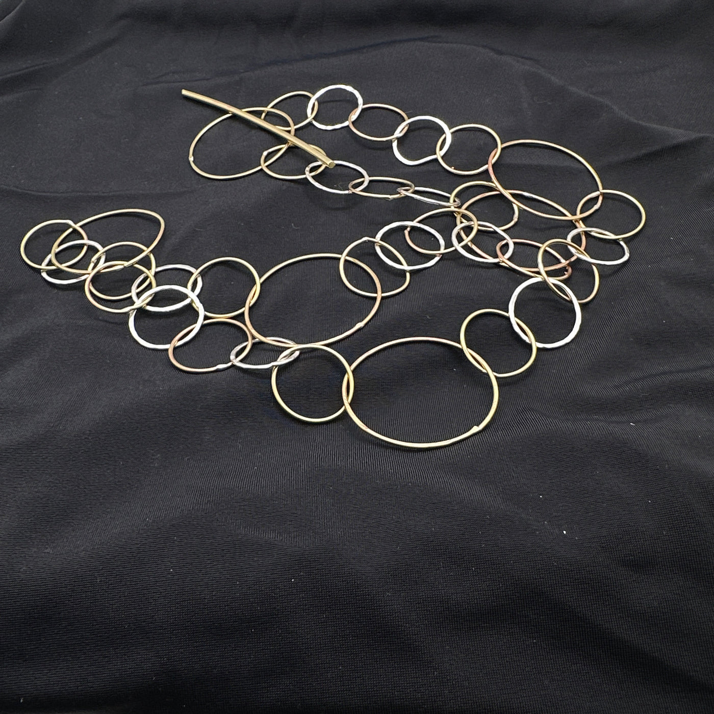 Silver and brass handmade circle chains with linear close