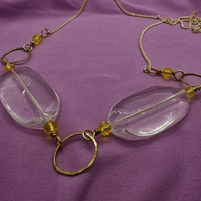 Brass handmade circle, transparent glass and yellow crystals on brass chain