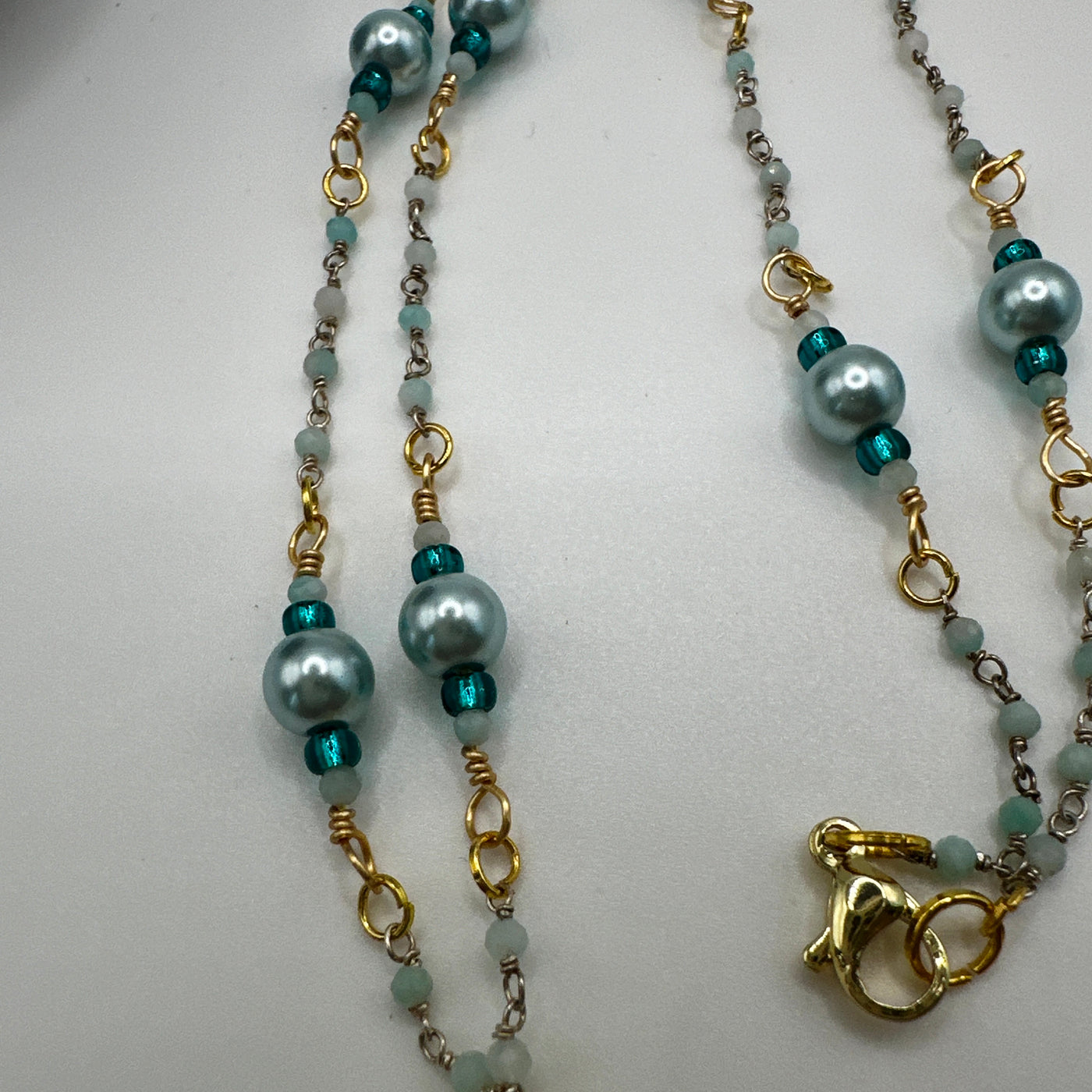 Short necklace silver 926 and light aqua beads with light blue pearls