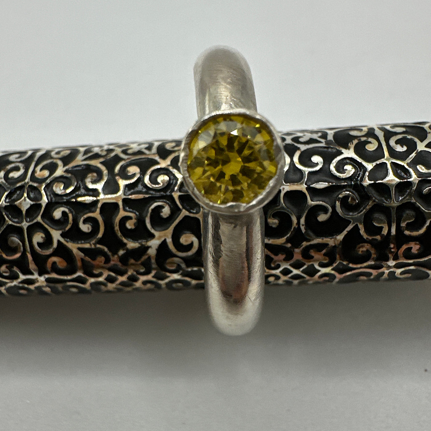 Yellow cubic zirconia set in tube for a sterling silver ring