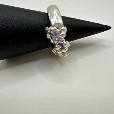 Wax lost granulation silver ring with violet cubic zirconia incapsulated