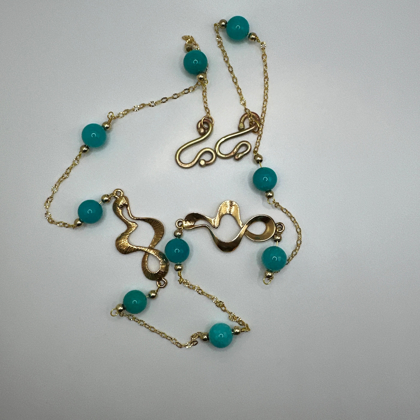 Zama spiralled elements with giada turquoise and steel pearls on brass chain