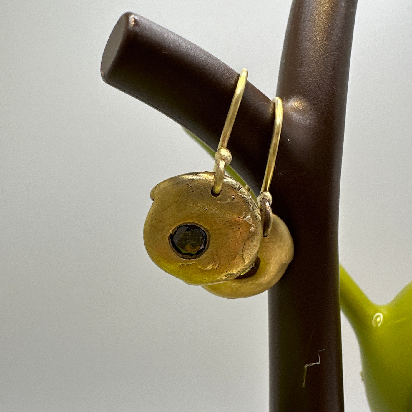 Brass earrings casted from lost wax with green cubic zirconia