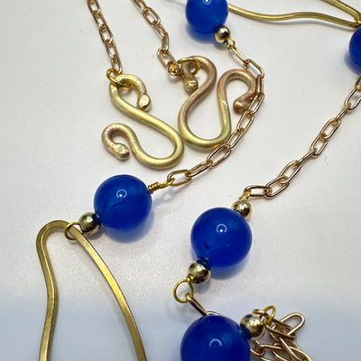 Bronze oval and brass chain with blue giade and steel dividers