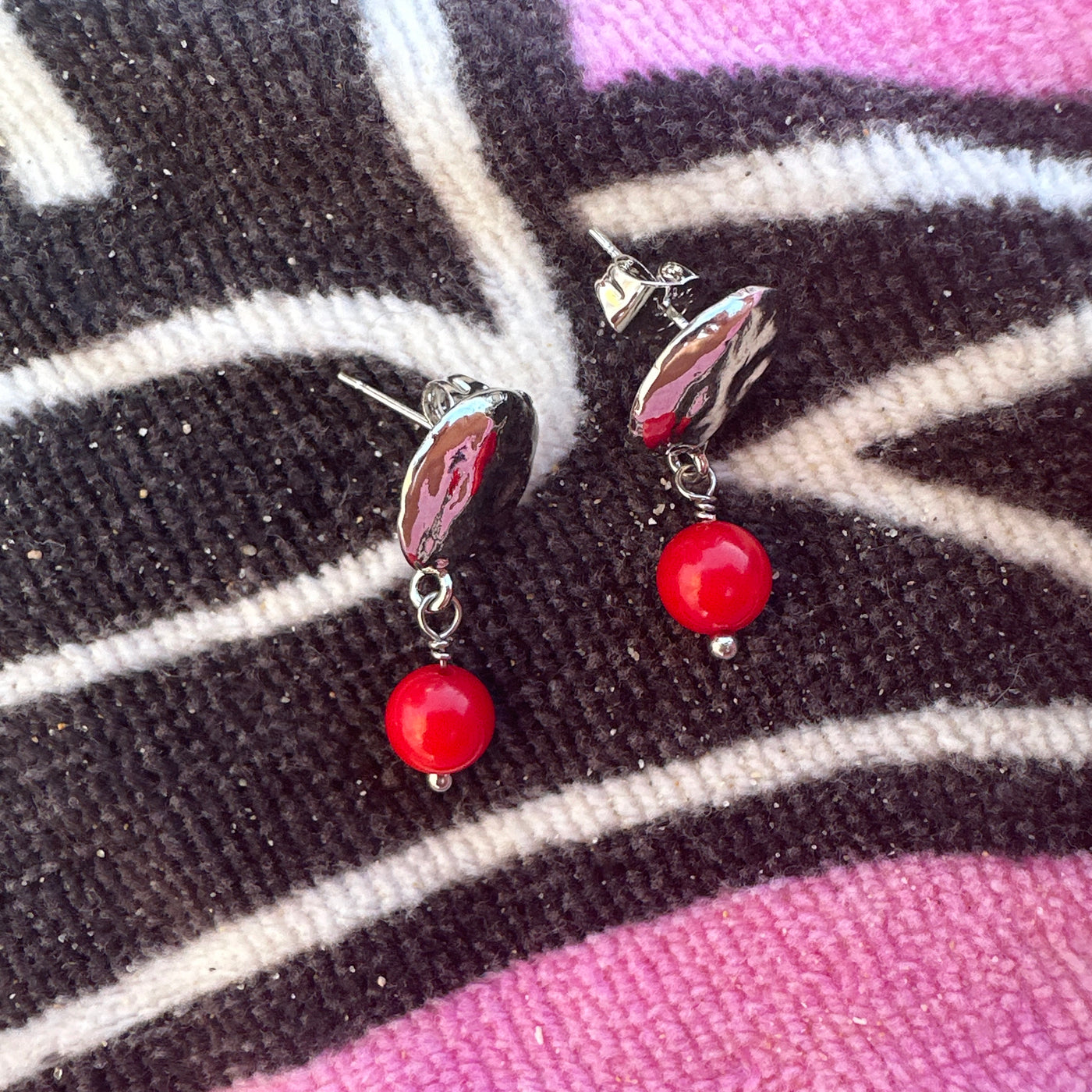 Red giada earrings with round silver colored brass elements