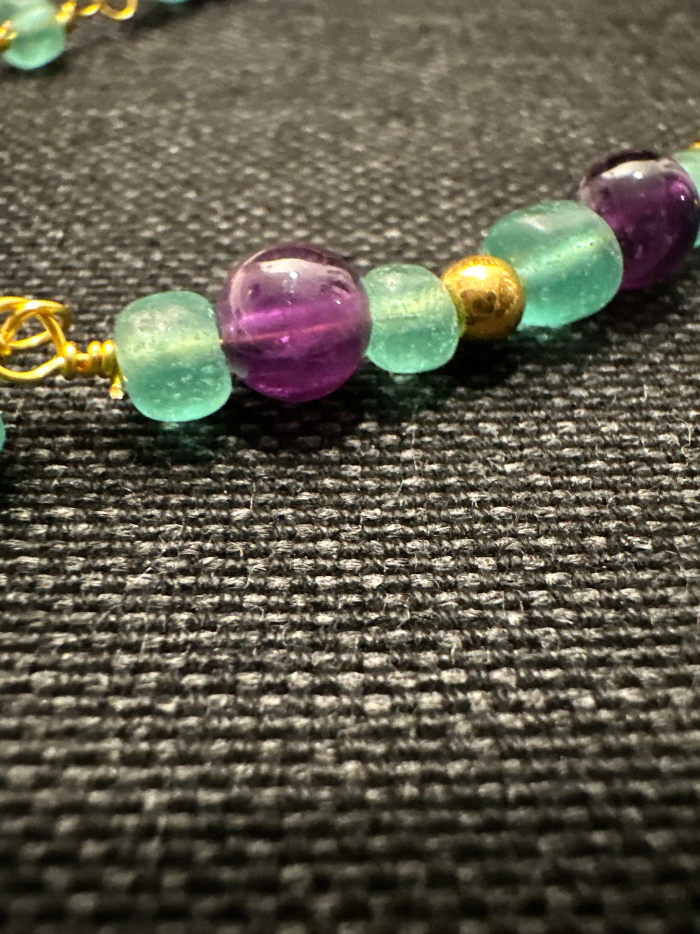 Amethysts, light green glass necklace on steel chain 'forzatina' gold plated