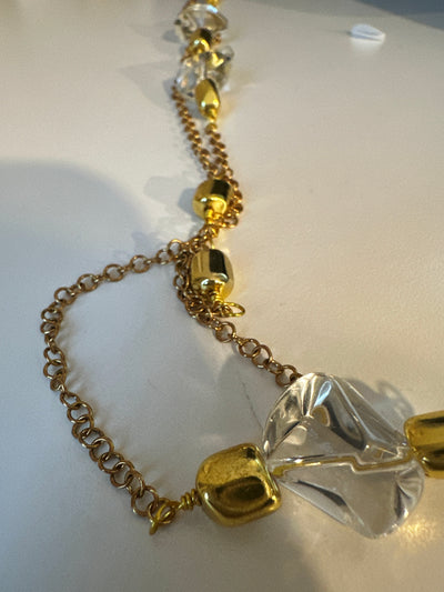 Transparent irregular crystals on 'forzatina' steel gold chain and brass gold elements. Long 74 cm