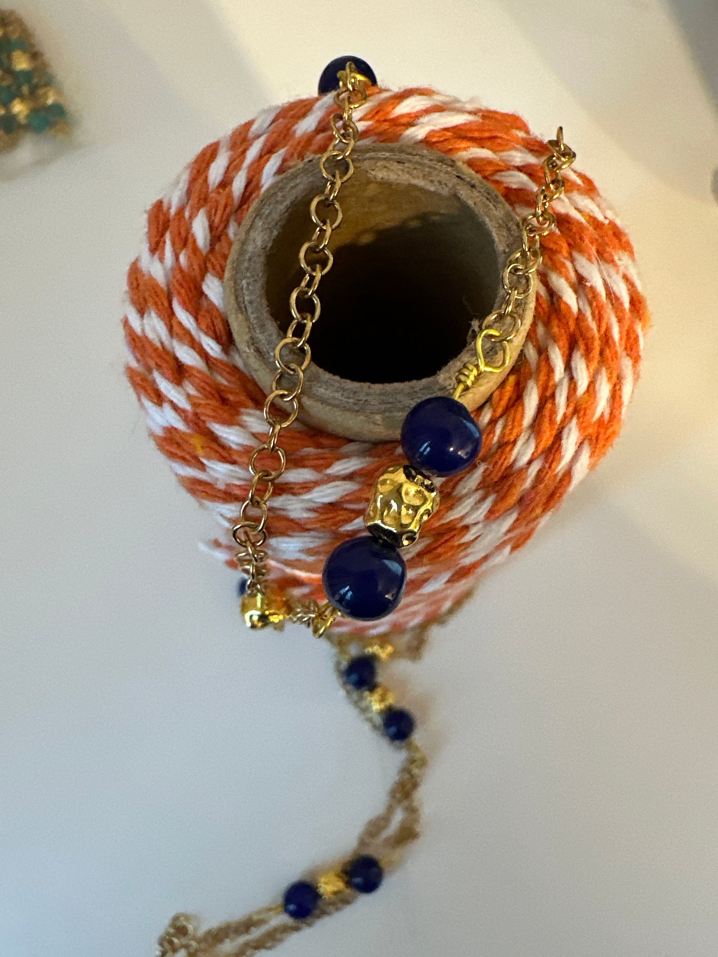 Blue giada on 'forzatina' steel gold chain and brass gold irregular elements. Long 98 cm