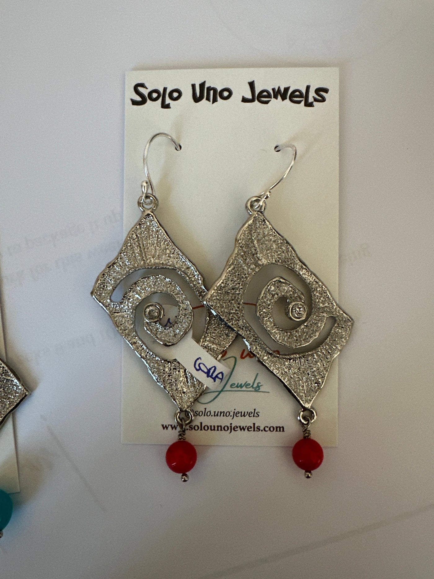 Coral earrings on silver colored brass triangular elements with zircon. Long 8 cm 