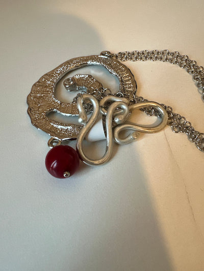 Red jade and silver colored brass round element pendant with zircon on steel silver forzatina and hand made closure. Long 80 cm