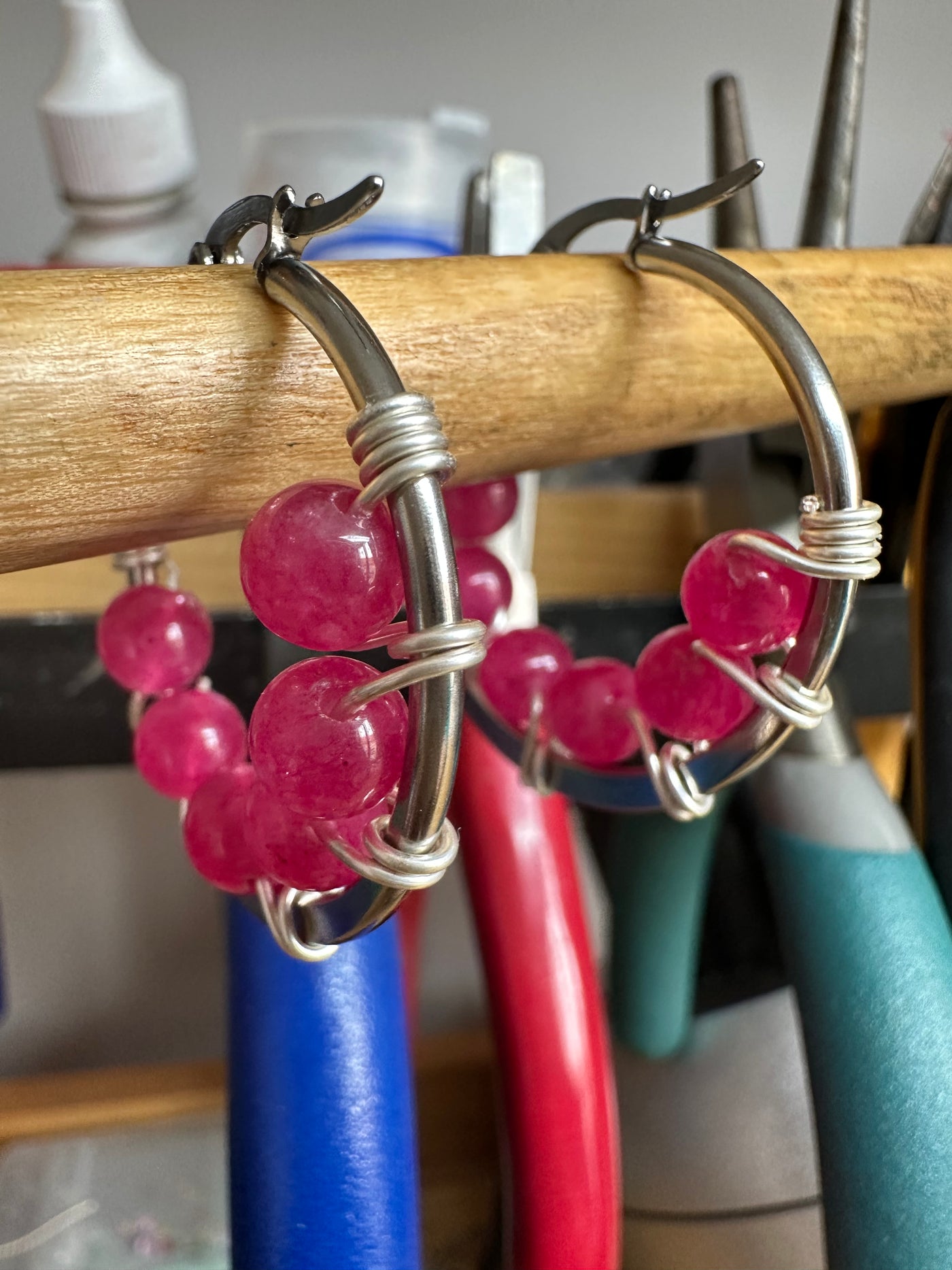Pink jade earrings on round plate steel circle