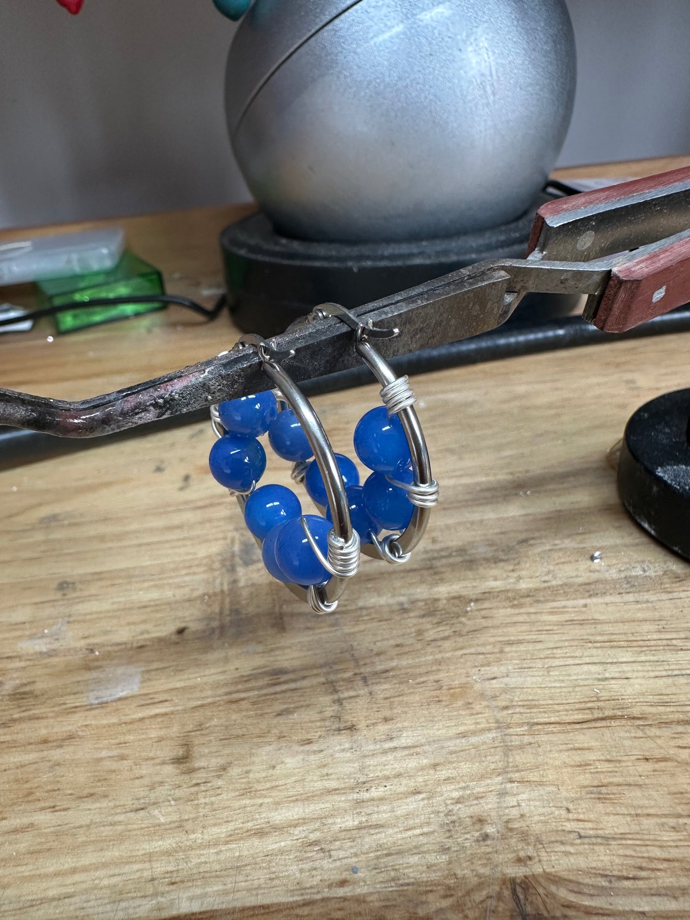 Blue jade earrings on round plate steel circle
