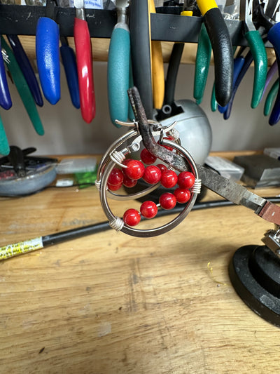 Coral red bamboo earrings on round plate steel circle