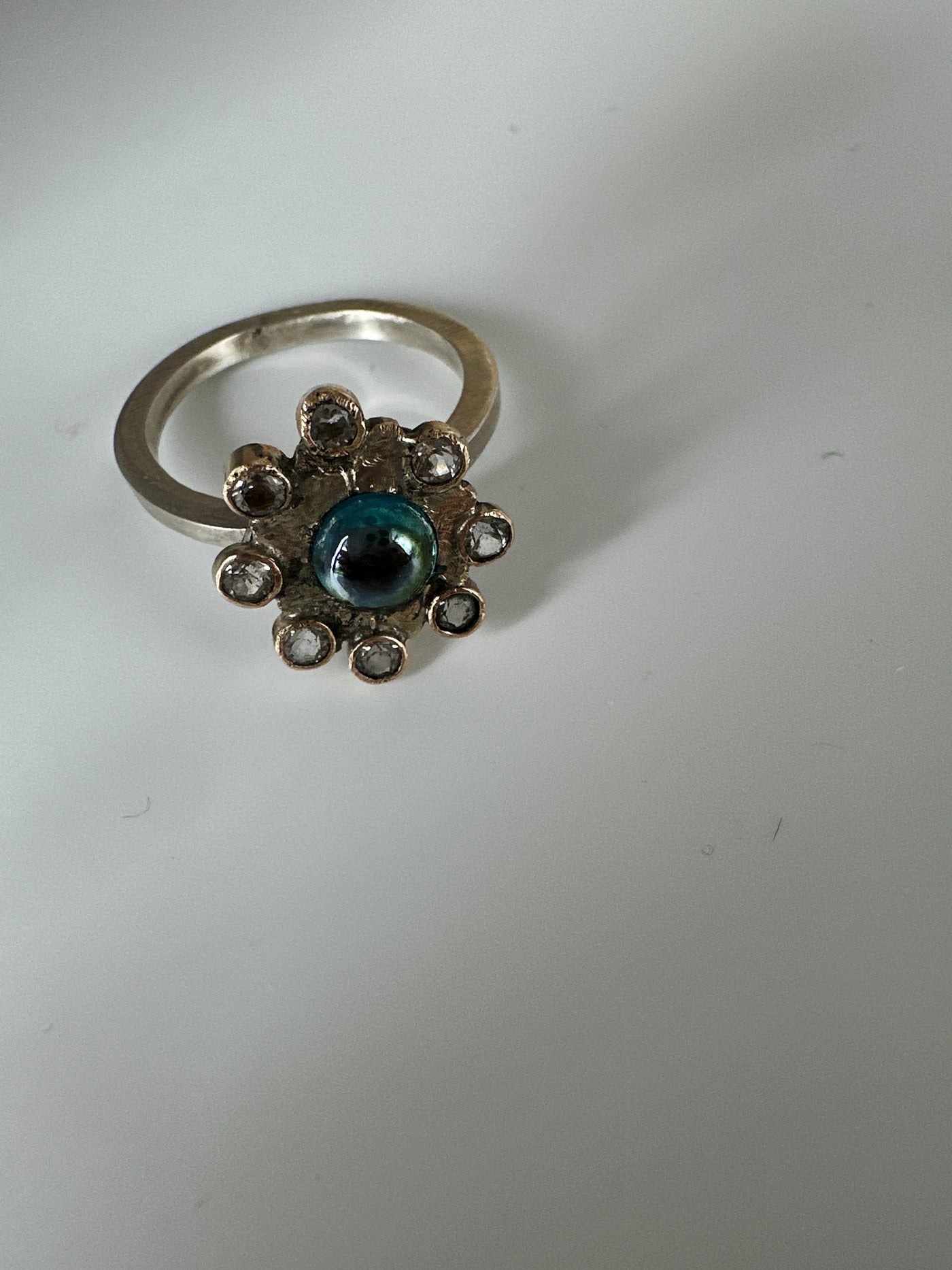 Irregular silver flower ring with cubic zirconias and galazio blue topaz 6 mm, ring size O/P