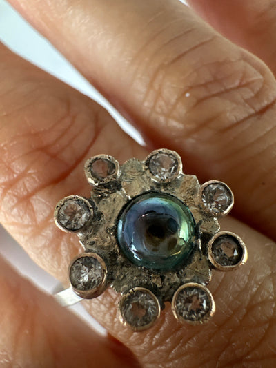 Irregular silver flower ring with cubic zirconias and galazio blue topaz 6 mm, ring size O/P