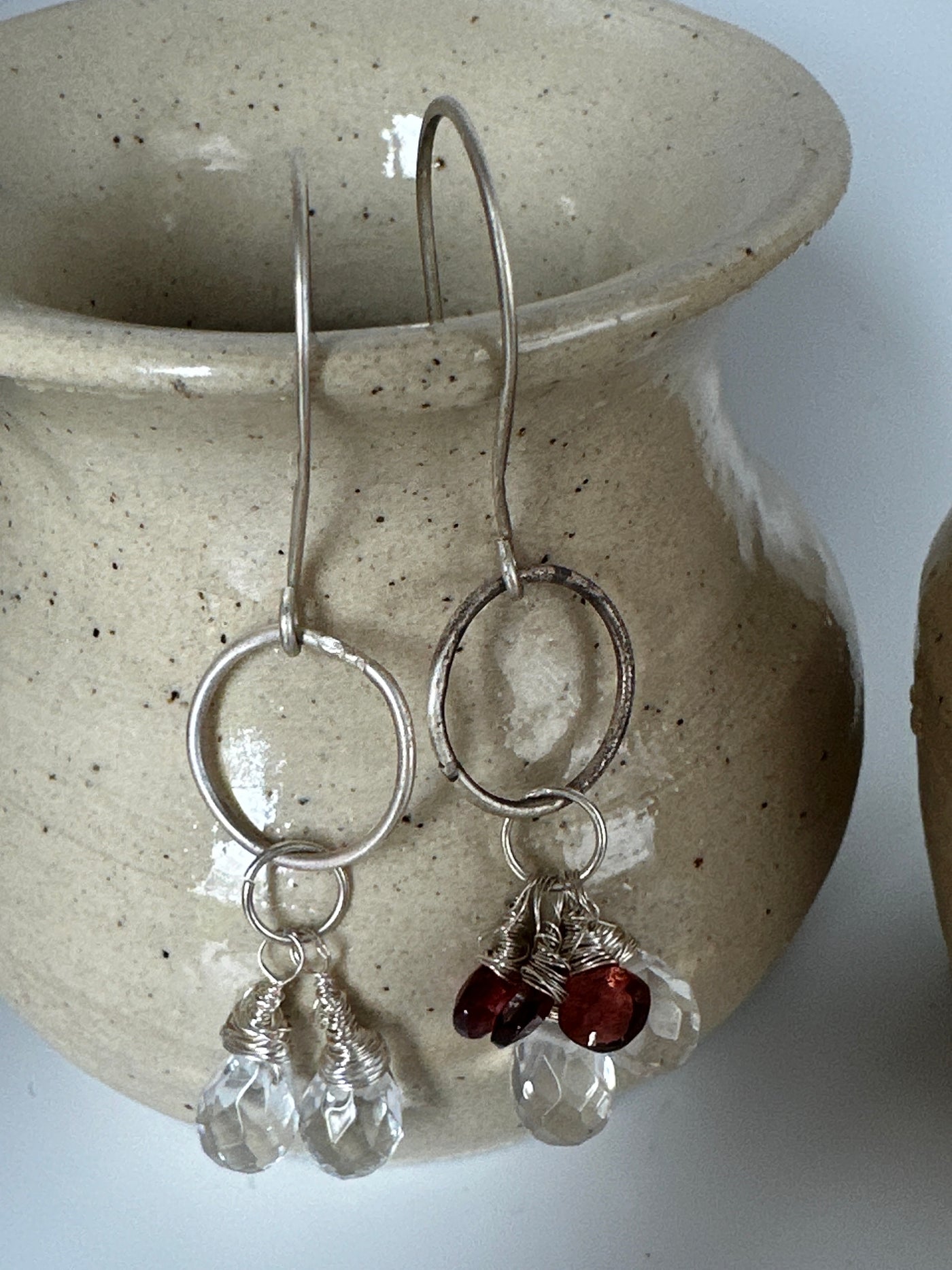 A-symmetric silver earrings with pear shaped crystals