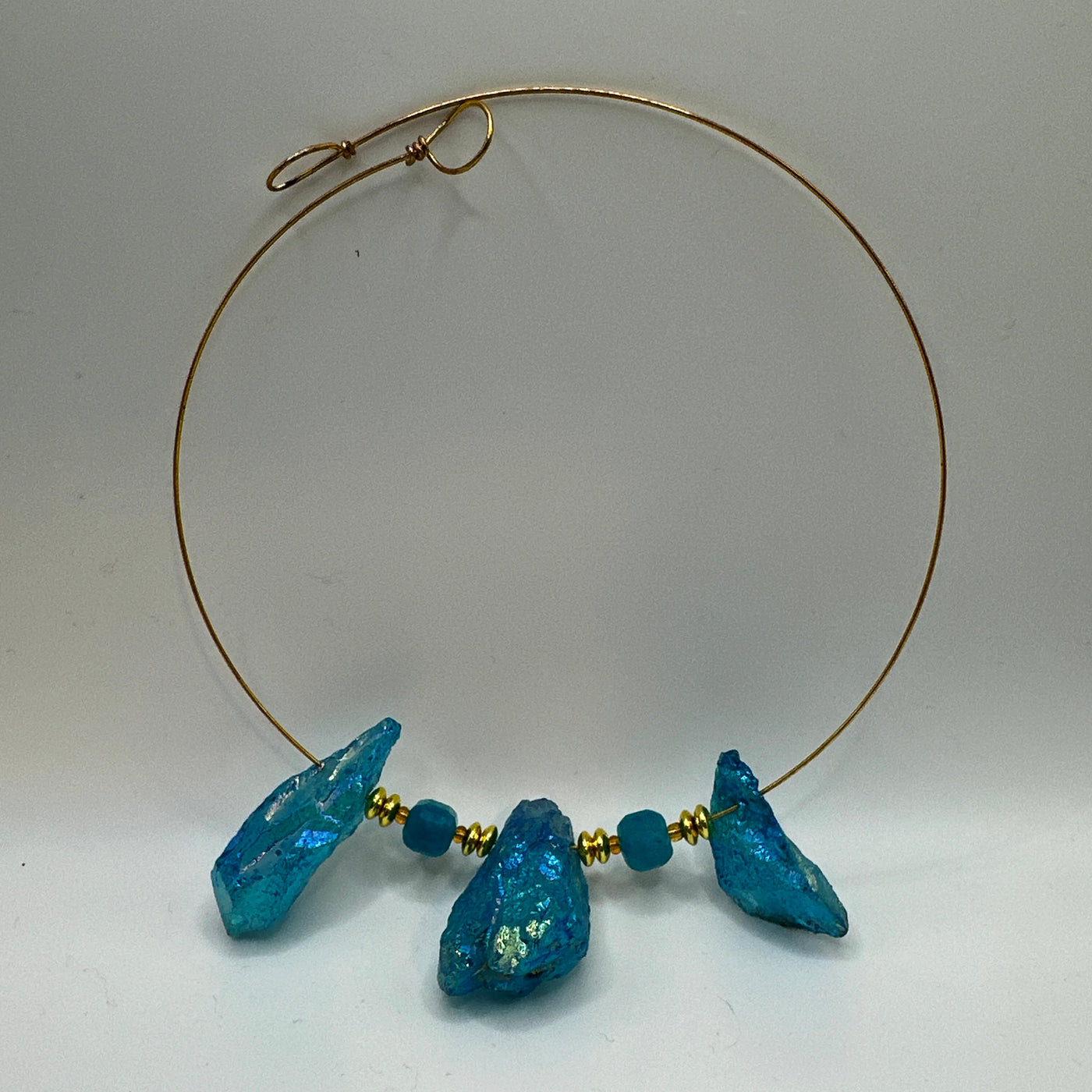 Round rigid necklace in steel with round brass and crystals rocks brilliant tourquoise elements