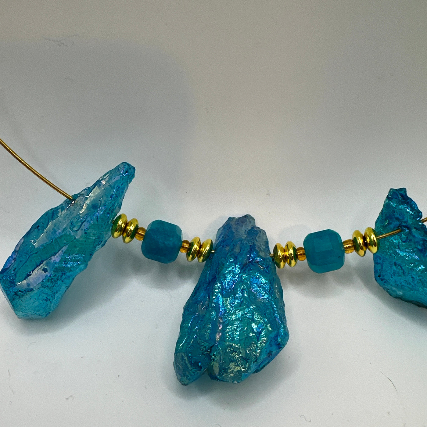 Round rigid necklace in steel with round brass and crystals rocks brilliant tourquoise elements