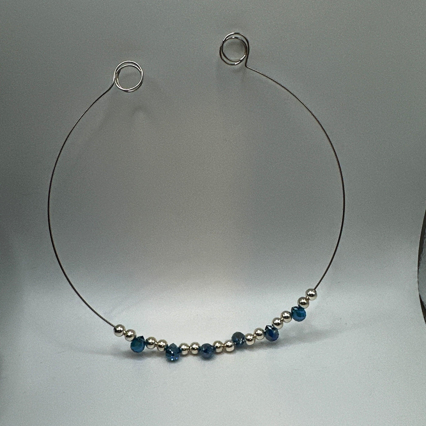 Round rigid necklace in steel with silver round brass and blue topaz briolette crystals elements