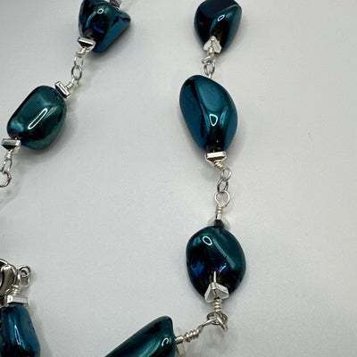 Rock crystal blue and triangular elements necklace