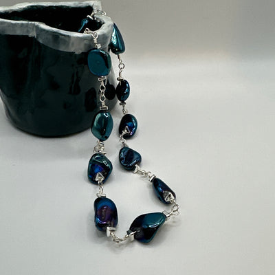 Rock crystal blue and triangular elements necklace