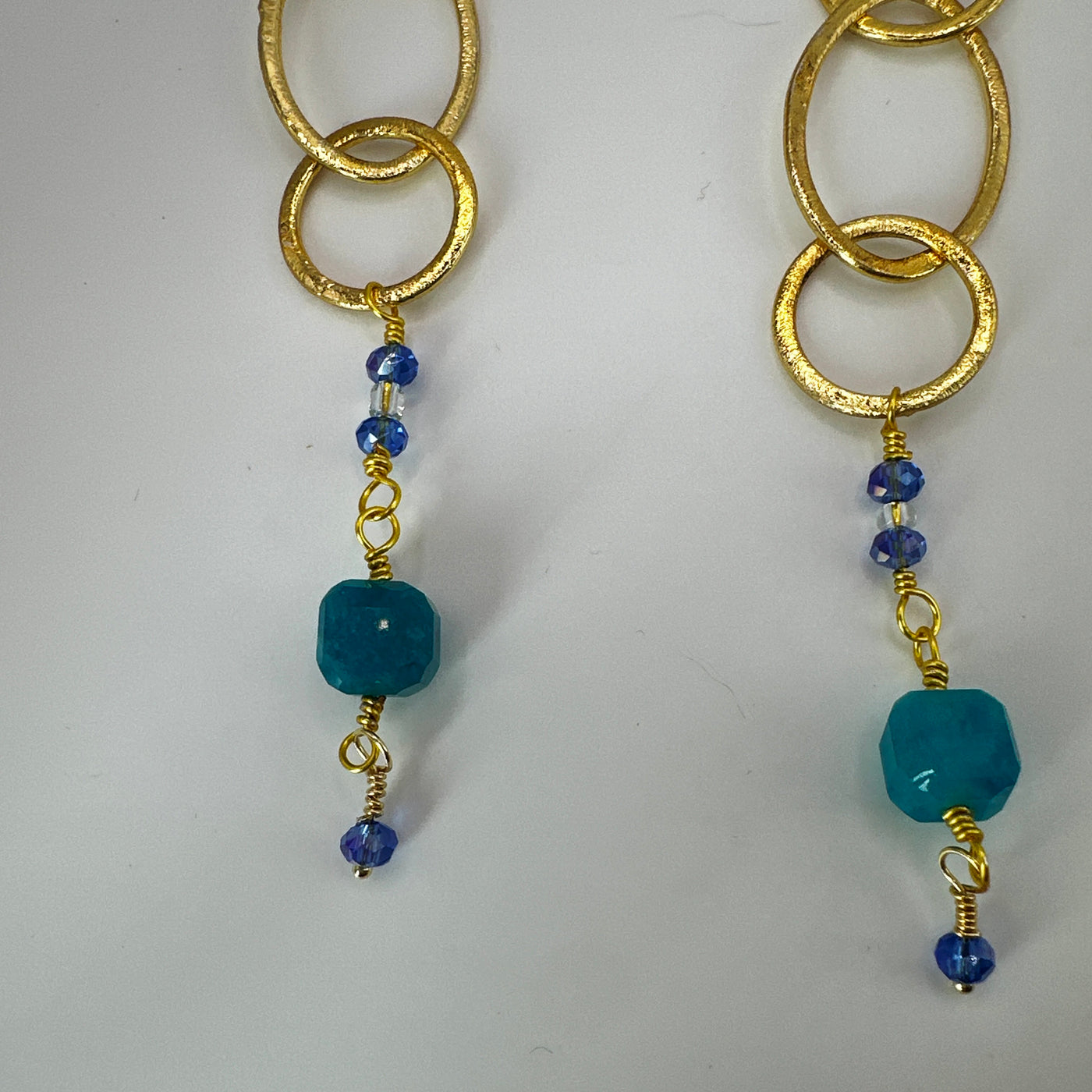 Brass round and ovals with crystal rondelles and blue square beads long earrings