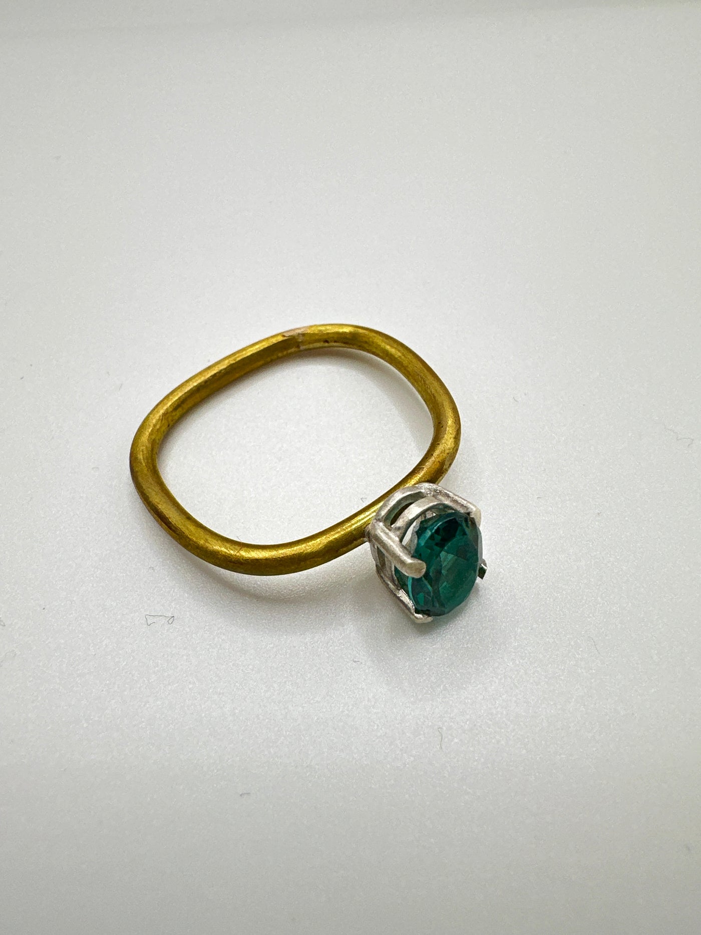 Enhanced teal topaz (8*6 oval) in silver cast and brass square ring