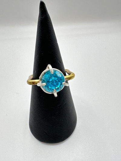 Syntetic blue corindone brillliant cut in silver cast and brass square ring