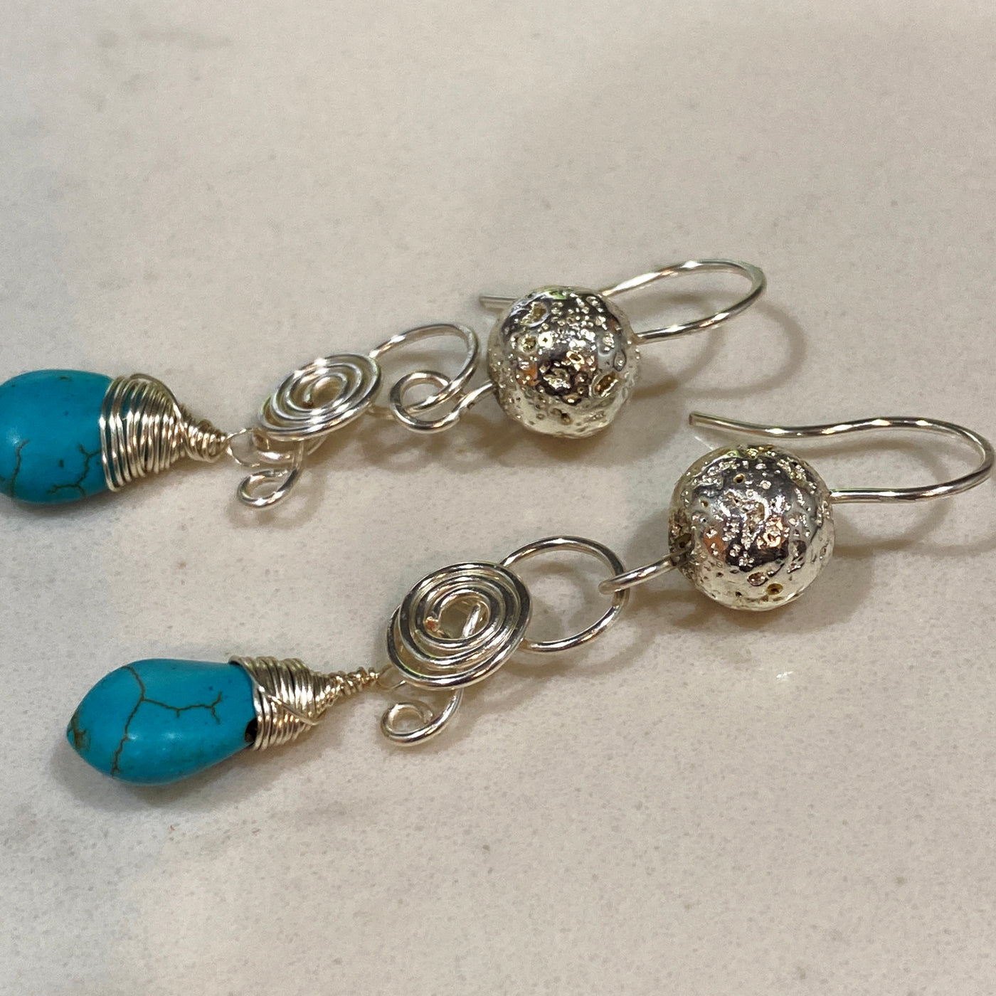 Lavastones silverplated and silver wrapped blue holwlite briolette earrings
