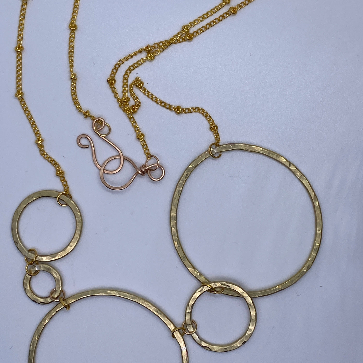 Brass circle texturized necklace on chain