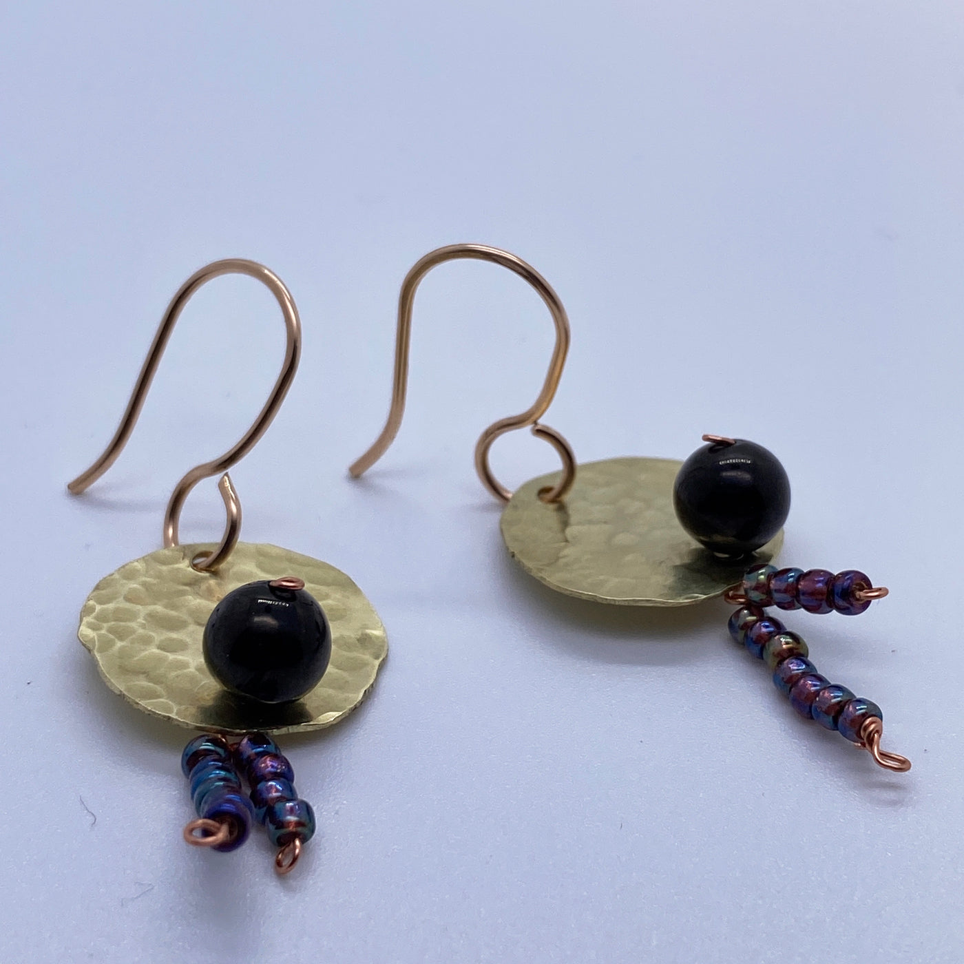 Small round circles, little beads hanging and jet 8 mm round dark bead
