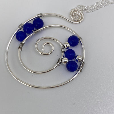 Medium silver pendant and blue calchedony agate