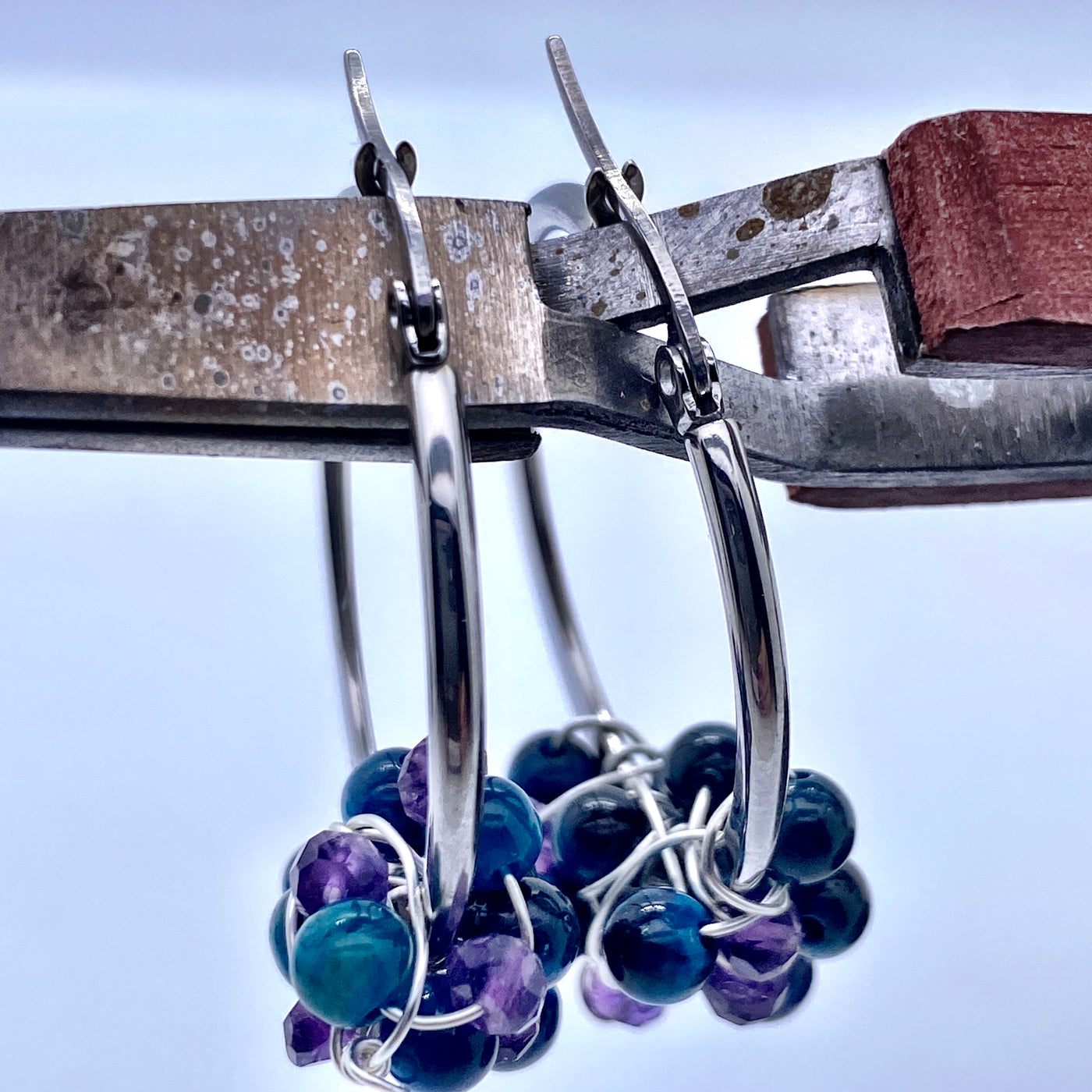 Round silver sterling earring with blue tiger eye and amethysts
