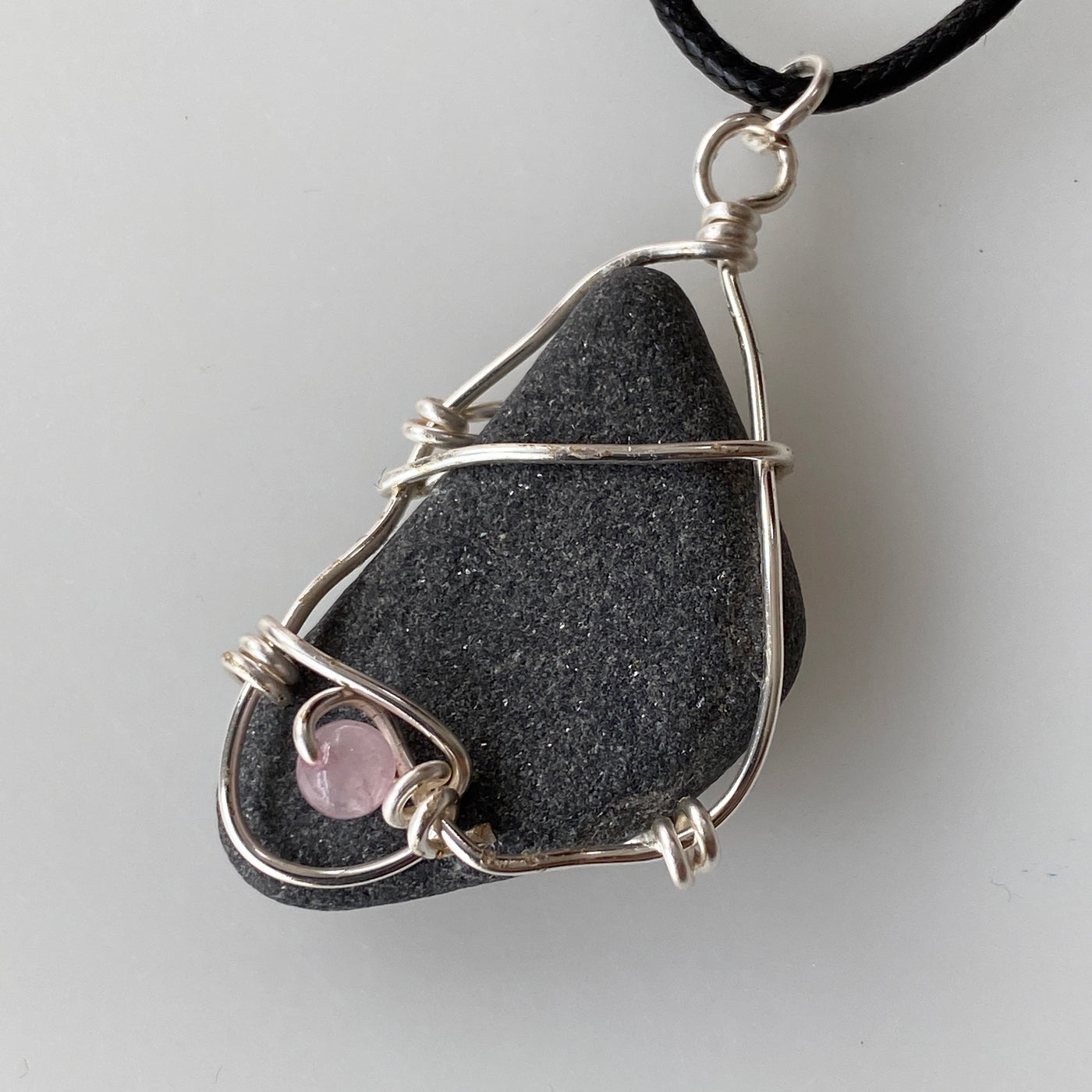 Grey natural stone, pink quartz and silver wire small pendant.