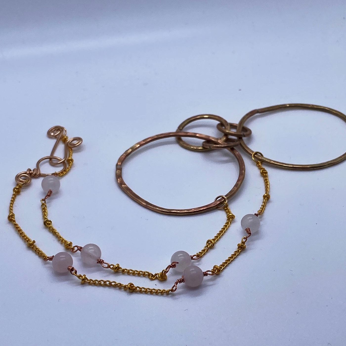 Brass circle texturized necklace on chain with rose quartz
