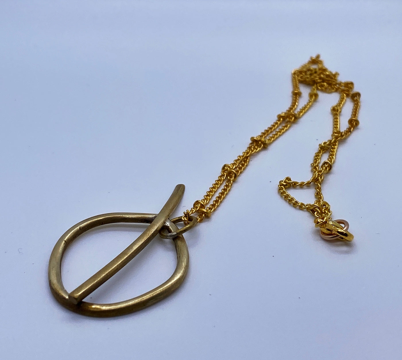 Apple brass pendant.